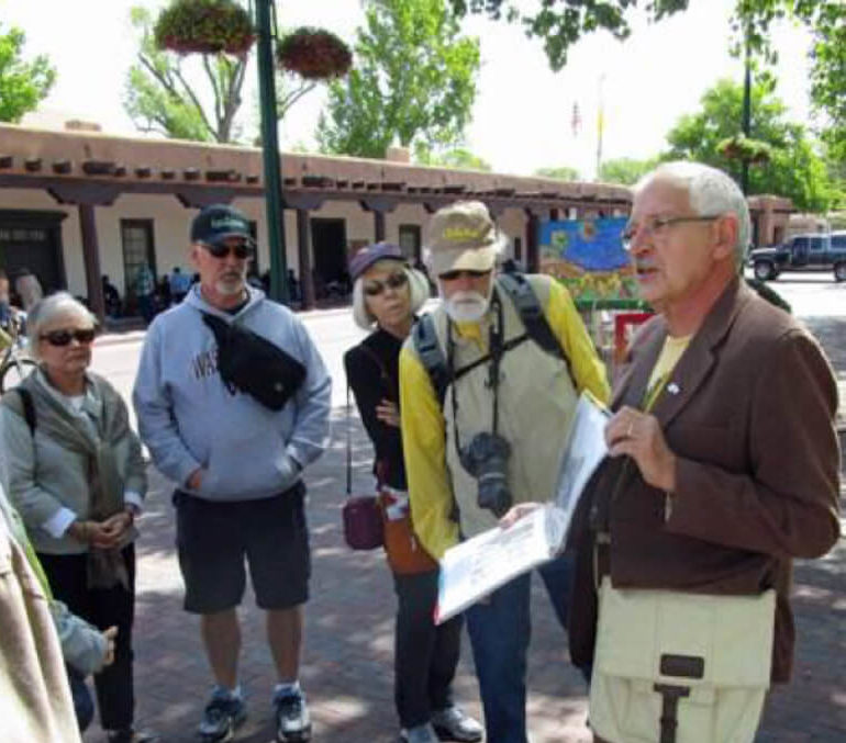 Walking tour guide speaking to participants